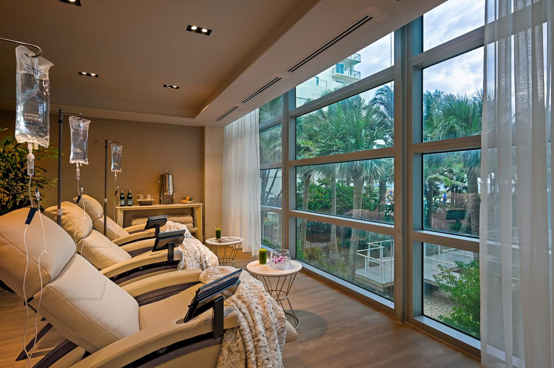 A serene relaxation lounge with daybeds and wide ocean windows