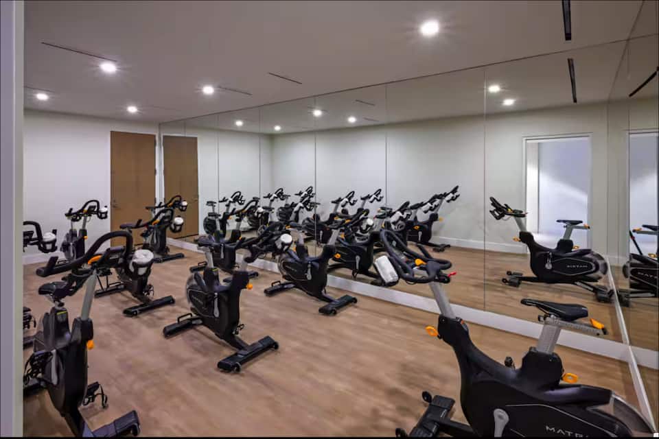 The cycling studio with rows of stationary bikes