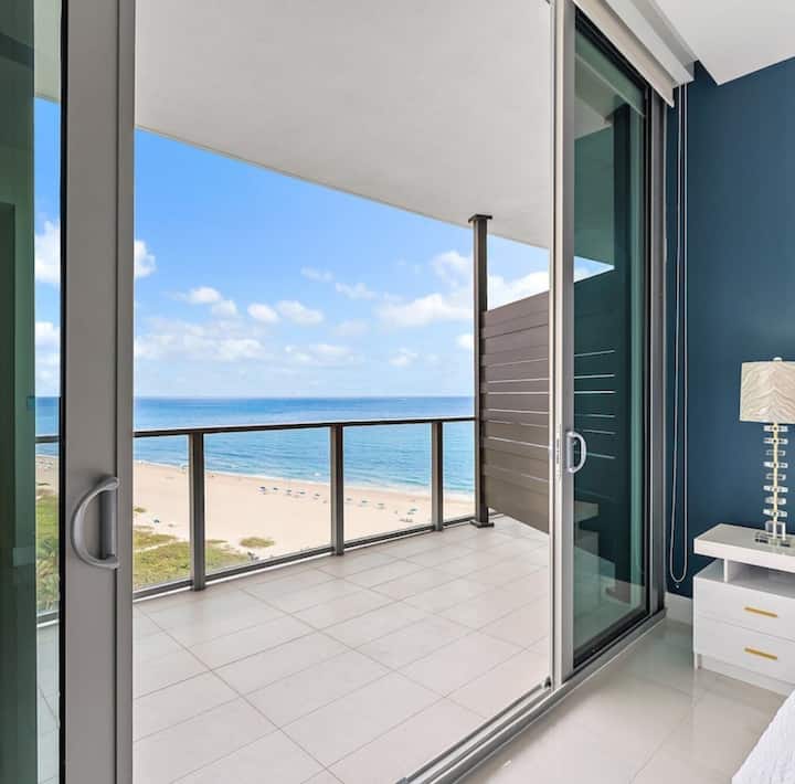 The balcony outside the second bedroom, with the beach and turquoise water below