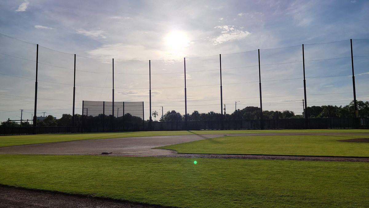 A practice field in the Nationals complex at CACTI Park of the Palm Beaches, with tall netting behind the infield
