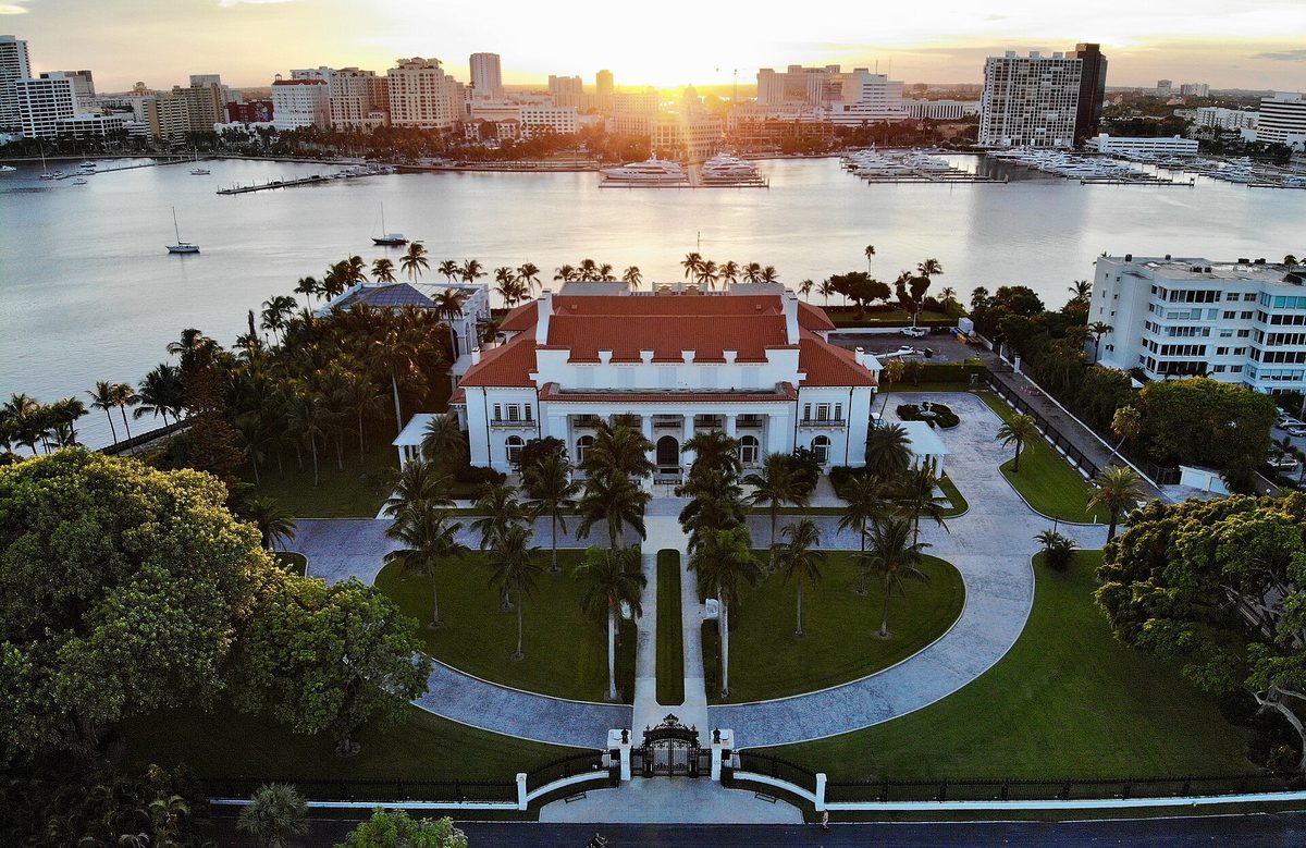 Whitehall, the Flagler Museum, seen from above with its red tile roof, palms and lawns on the Lake Worth Lagoon